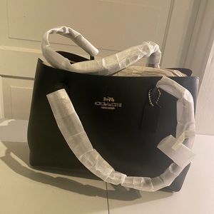 Authentic Coach bag. Never used. Still has tags and protective covers.